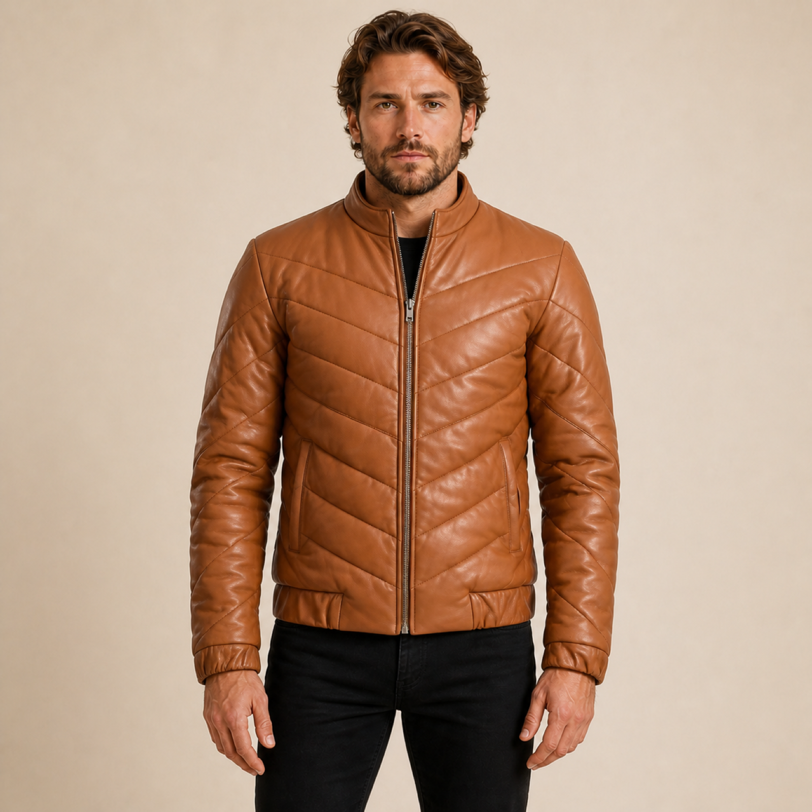 Front view of a man wearing a MOTOGRIP GEAR tan brown chevron quilted sheepskin leather puffer jacket.