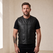 Man wearing a black cowhide leather motorcycle vest from the front.