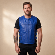 Man wearing a blue cowhide leather motorcycle vest from the front.