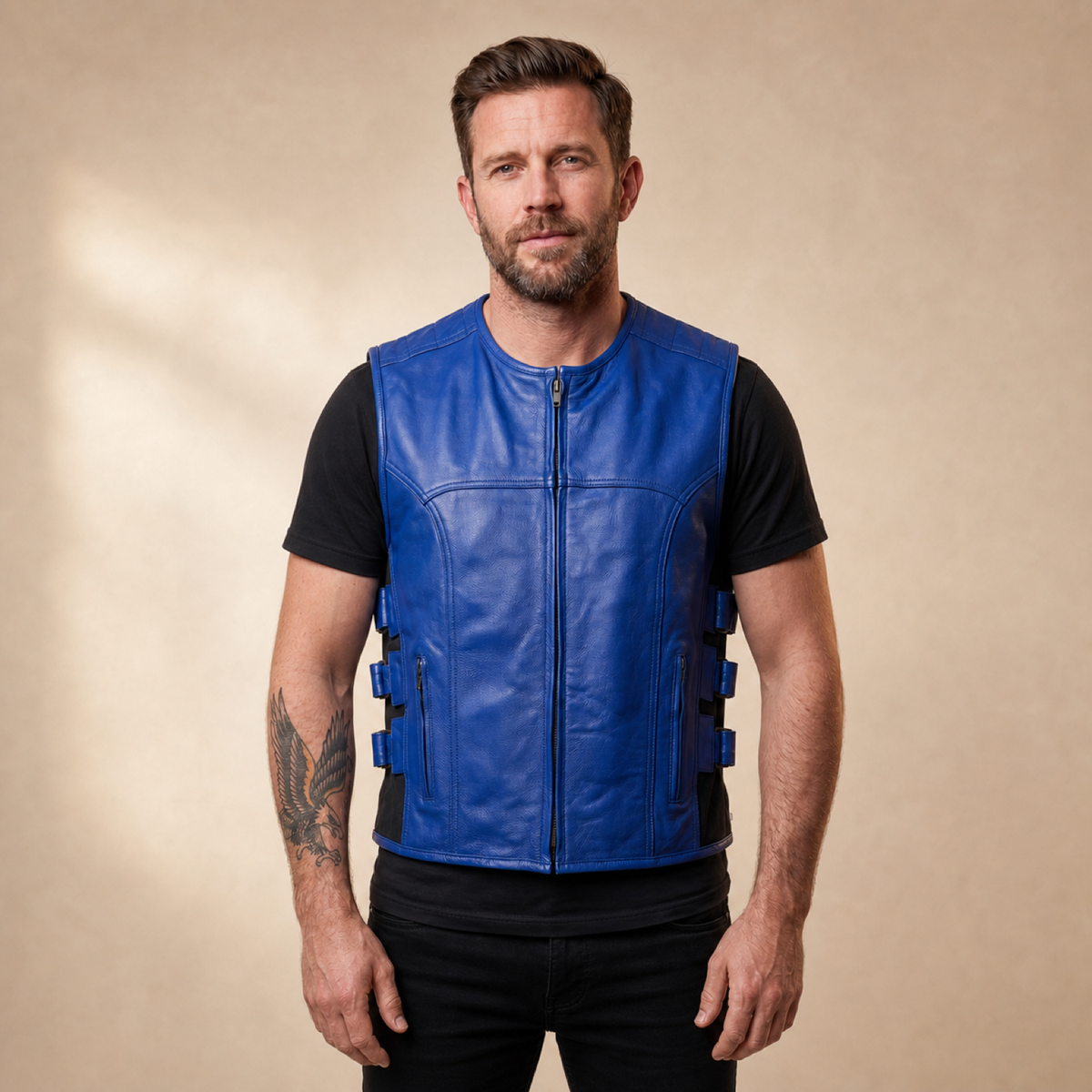 Man wearing a blue cowhide leather motorcycle vest from the front.