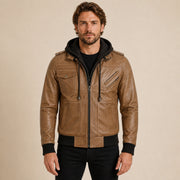 MOTOGRIP GEAR men's camel brown leather jacket with removable hood worn by model, front view on warm beige background.