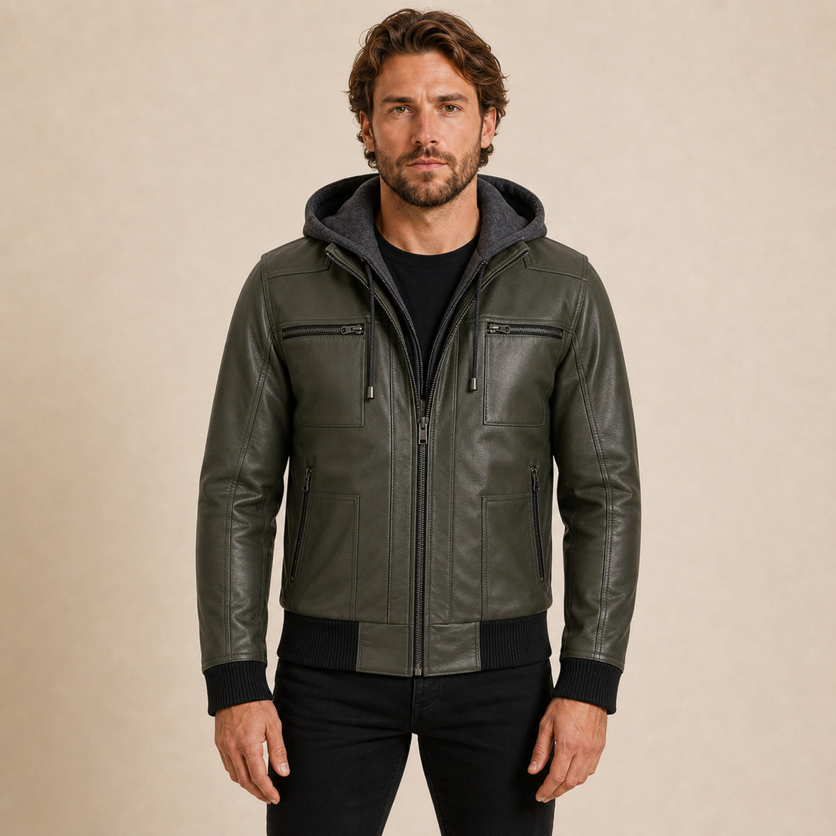 MOTOGRIP GEAR men's olive green real leather jacket with removable hood worn by model, front view on warm beige background.