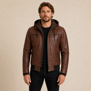 Man wearing a MOTOGRIP GEAR cognac wax removable-hood lambskin bomber jacket, front view.