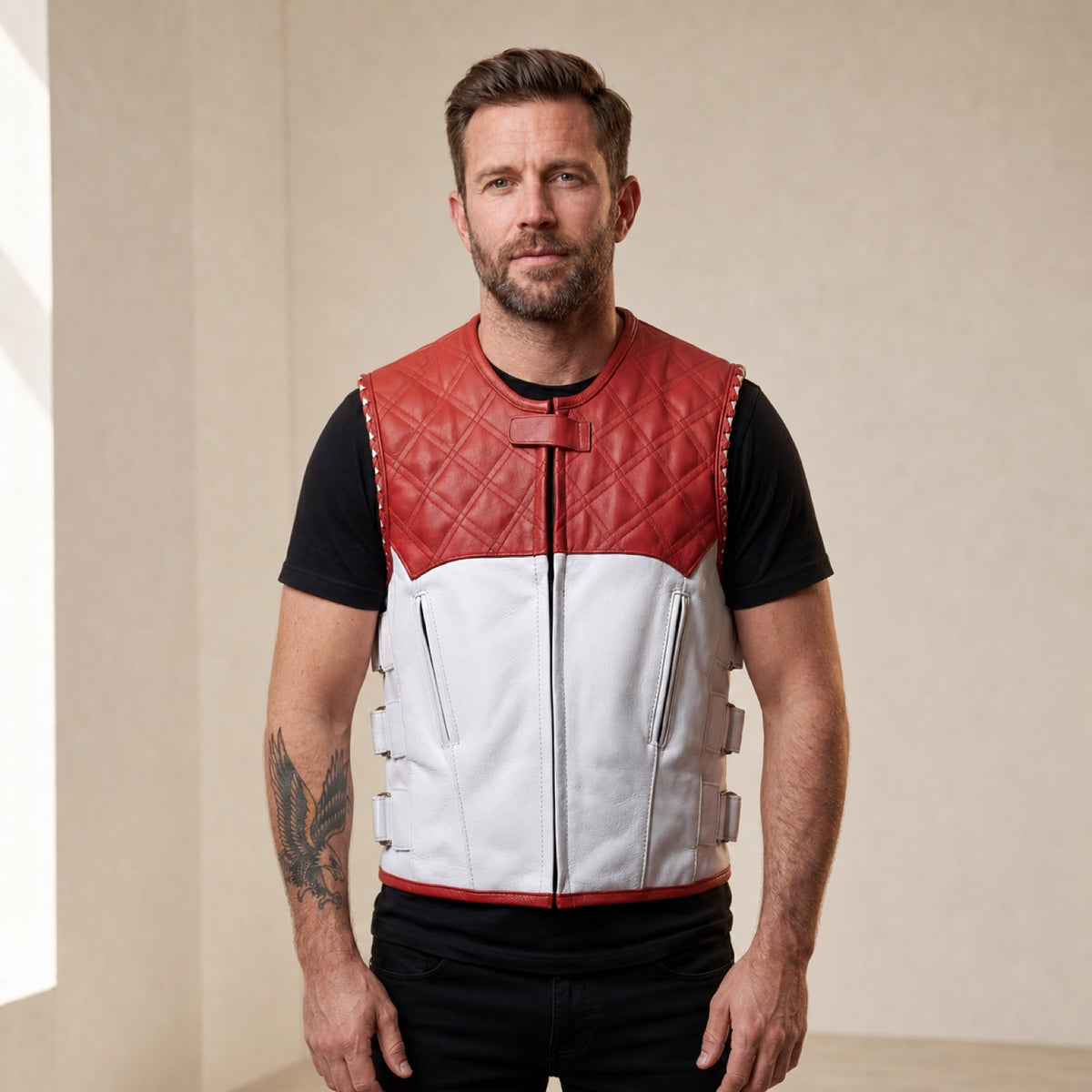 Man wearing a red and white quilted leather motorcycle vest from the front.