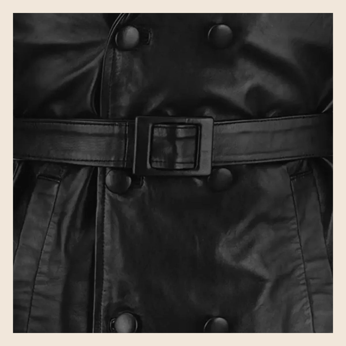 MOTOGRIP Bramwell men's 1970s Black Leather Trench Coat, close-up of the waist belt and buttons.