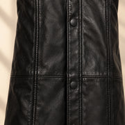 Close view of the Nightwarden trench vertical panel seams and snaps