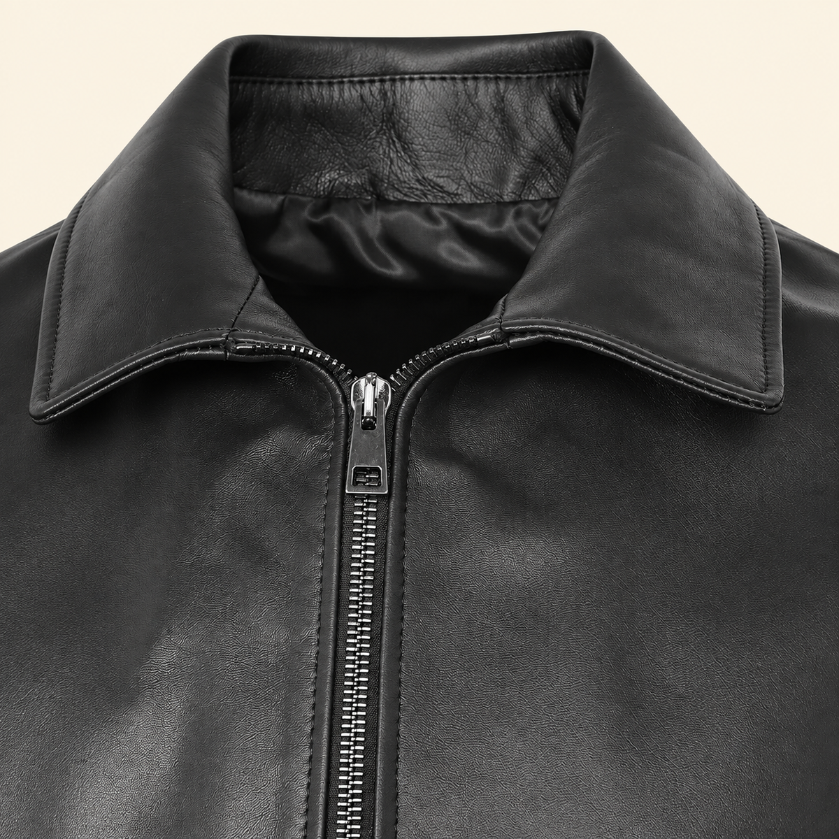 Black men's point-collar lambskin leather jacket, close up.