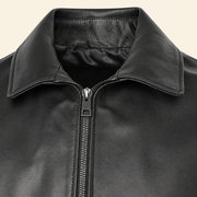 Black men's point-collar lambskin leather jacket, close up.