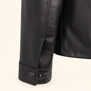 Black men's point-collar lambskin leather jacket, cuff detail.