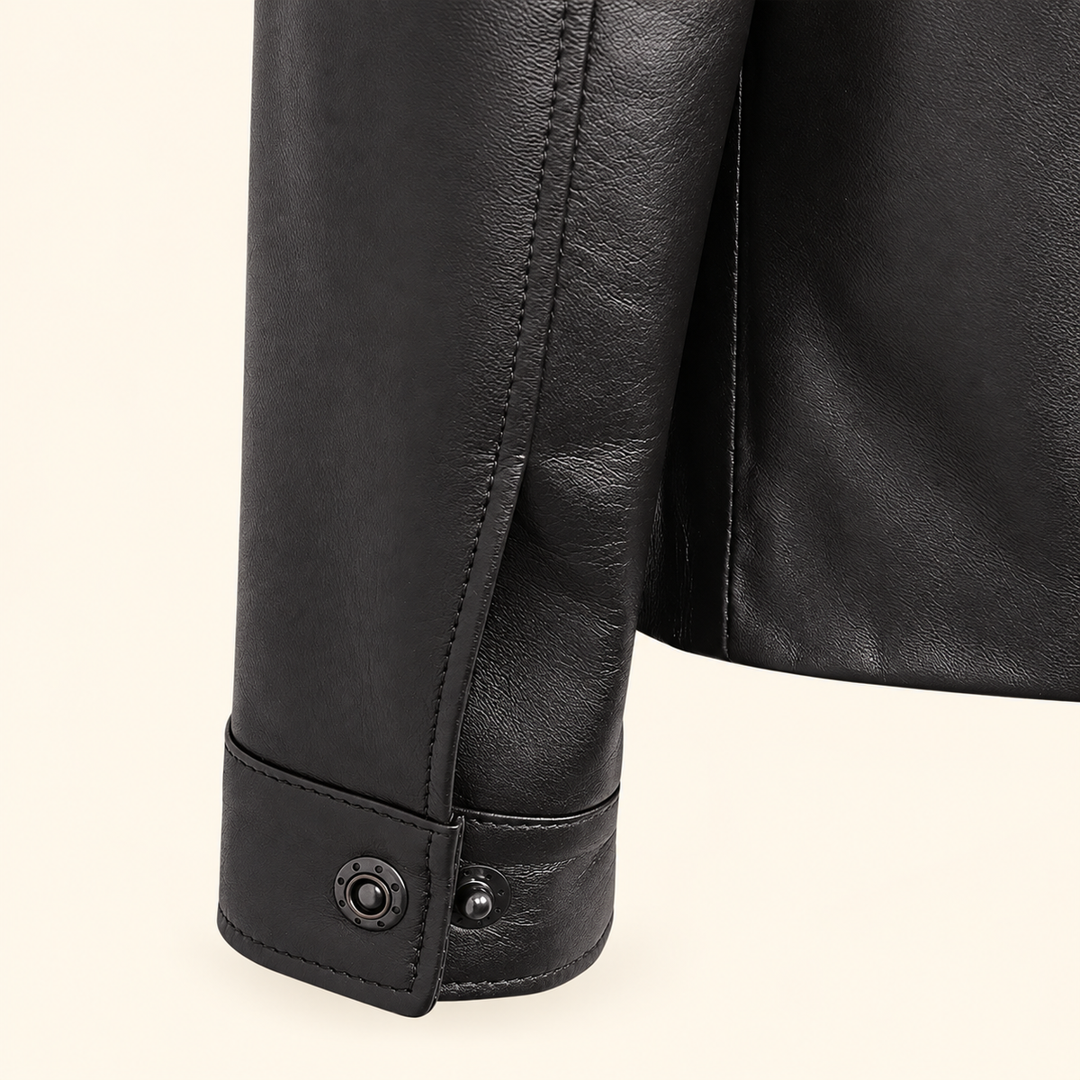 Black men's point-collar lambskin leather jacket, cuff detail.