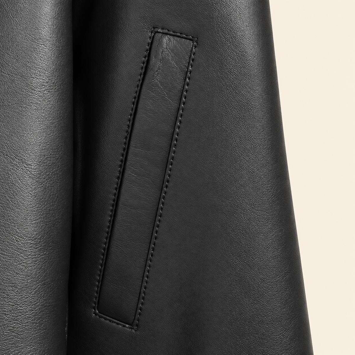 Black men's point-collar lambskin leather jacket, pocket detail.