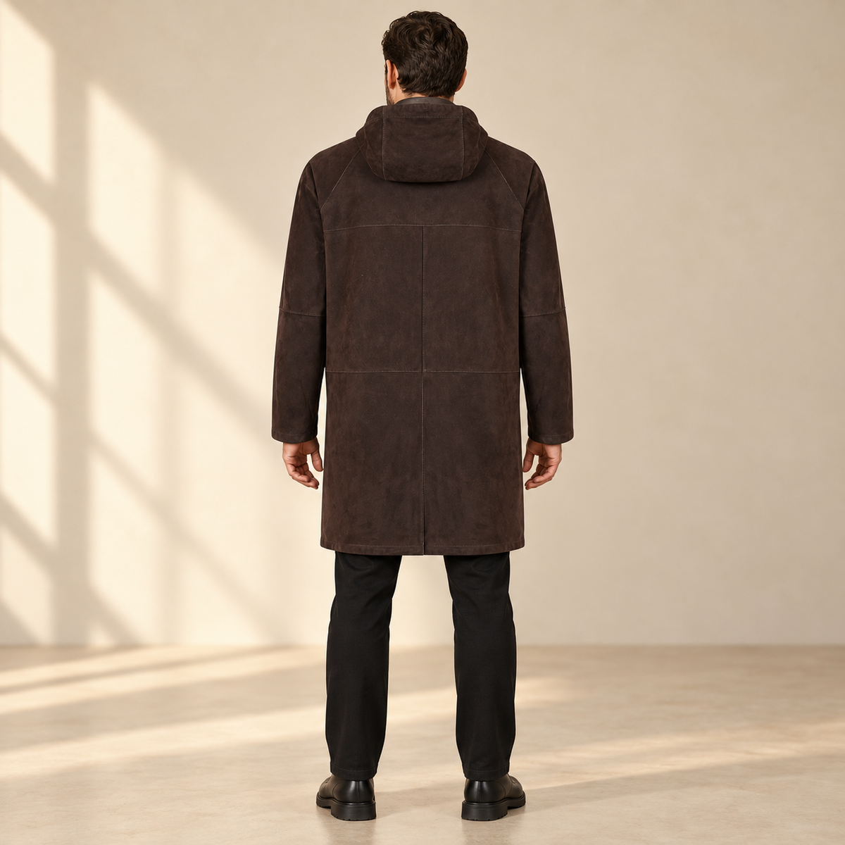 Rear view worn by a male model of the Bexley men's dark brown hooded reversible leather coat.