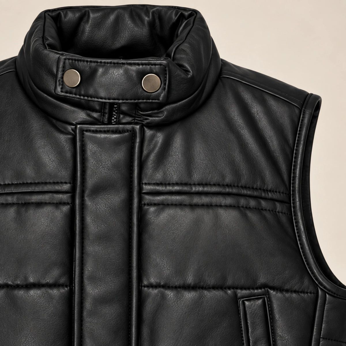 Braywick men's black genuine leather bubble puffer vest, collar, leather grain and padded panel close-up