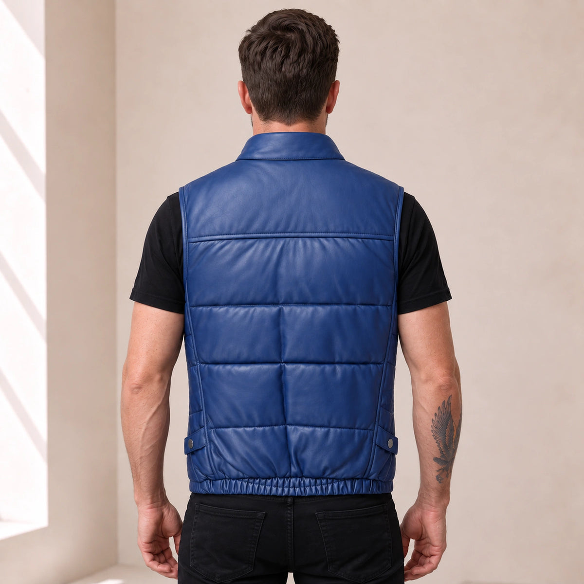 Braywick men's blue genuine leather bubble puffer vest, modeled back view