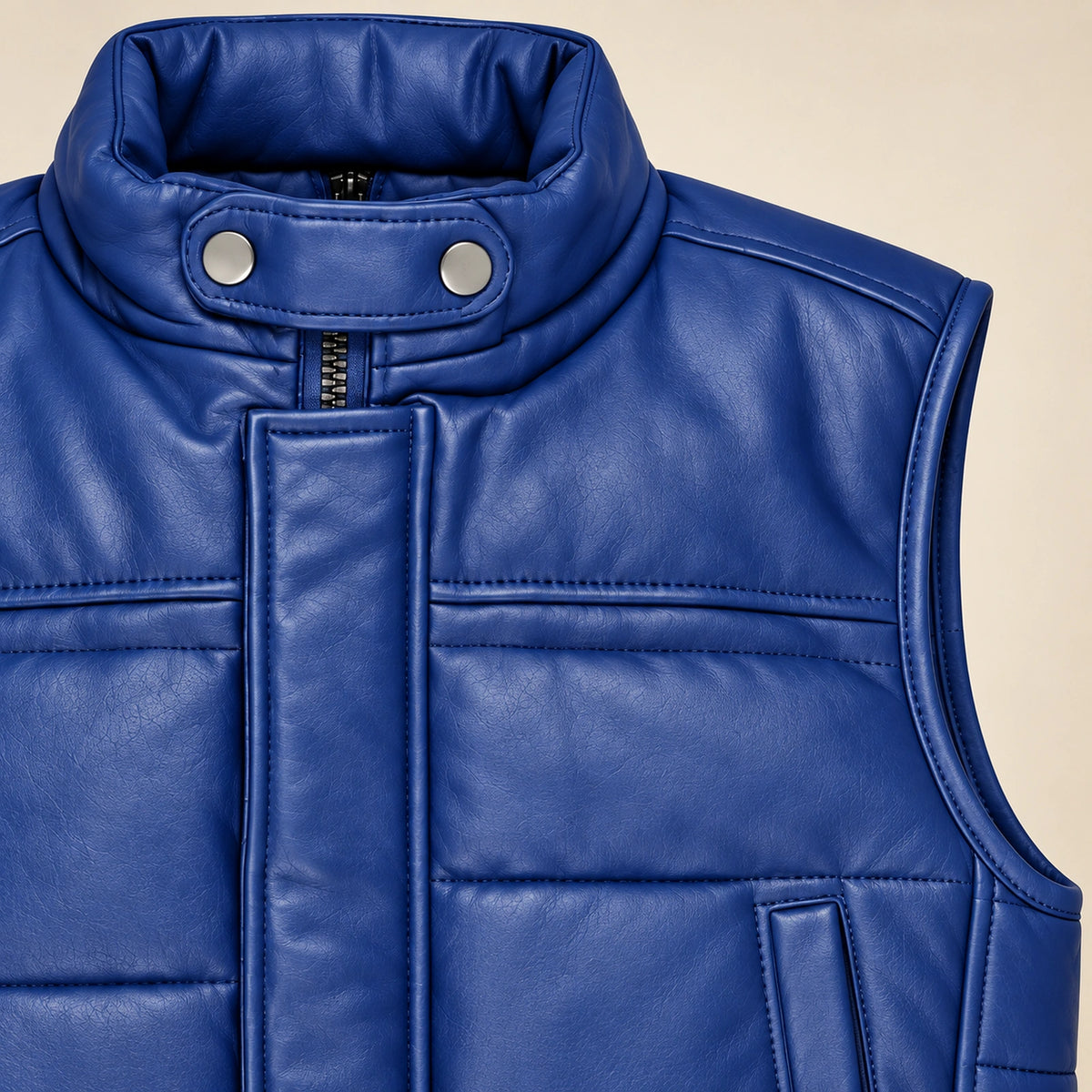 Braywick men's blue genuine leather bubble puffer vest, collar, leather grain and padded panel close-up