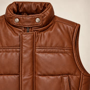 Braywick men's cognac genuine leather bubble puffer vest, collar, leather grain and padded panel close-up