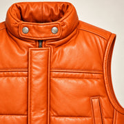 Braywick men's orange genuine leather bubble puffer vest, collar, leather grain and padded panel close-up