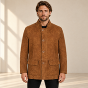 Front view worn by a male model of the Cairnwell men's brown blue reversible leather blazer coat.