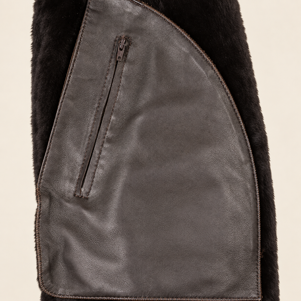 Interior construction and pocket detail of the Dalesmere men's dark brown shearling aviator jacket.