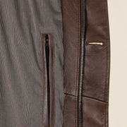 Interior construction and pocket detail of the Eversham men's dark brown mid-length leather coat.