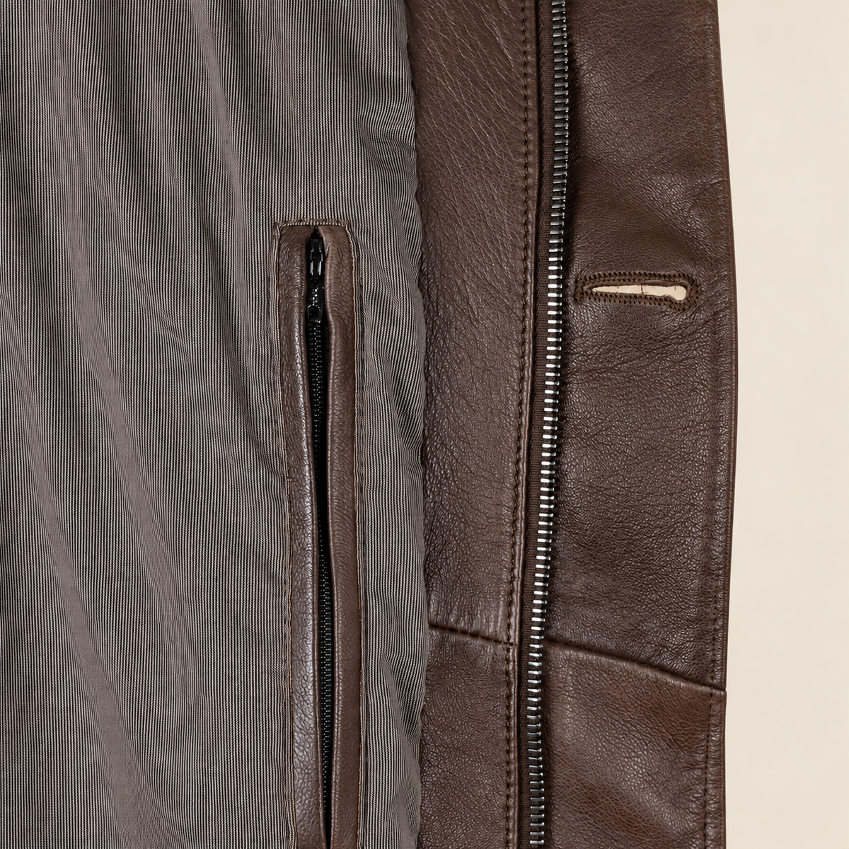 Interior construction and pocket detail of the Eversham men's dark brown mid-length leather coat.