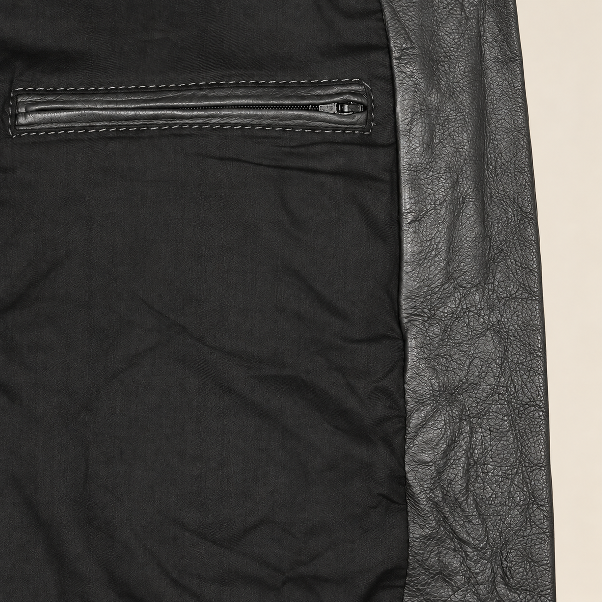 Interior construction and pocket detail of the Falkner men's black retro leather coat.