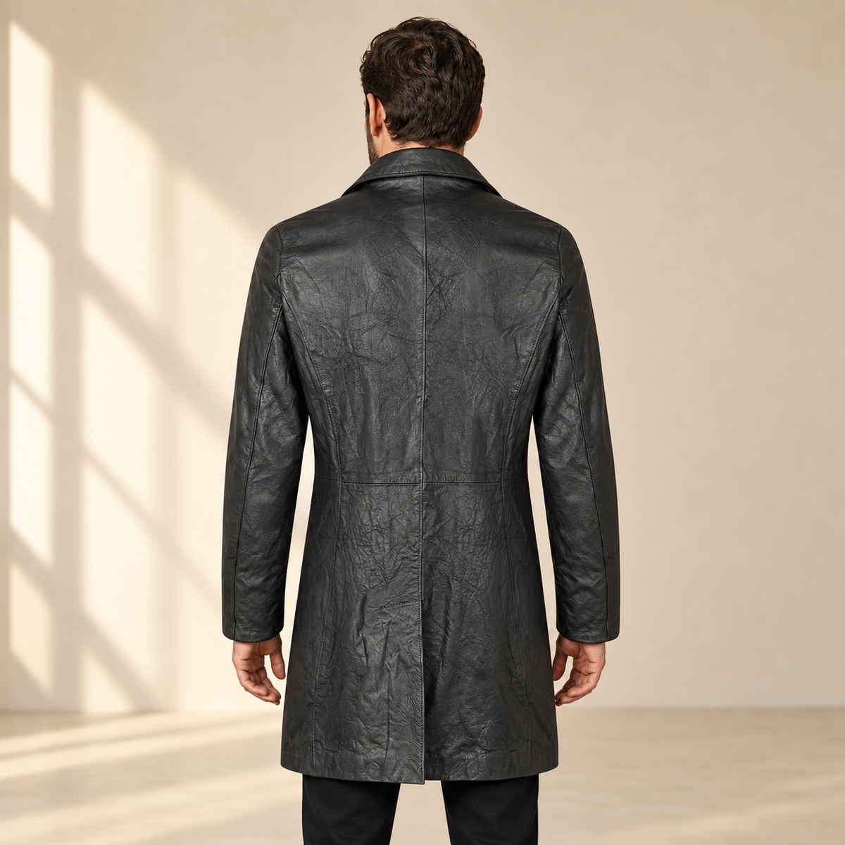 Rear view worn by a male model of the Falkner men's black retro leather coat.