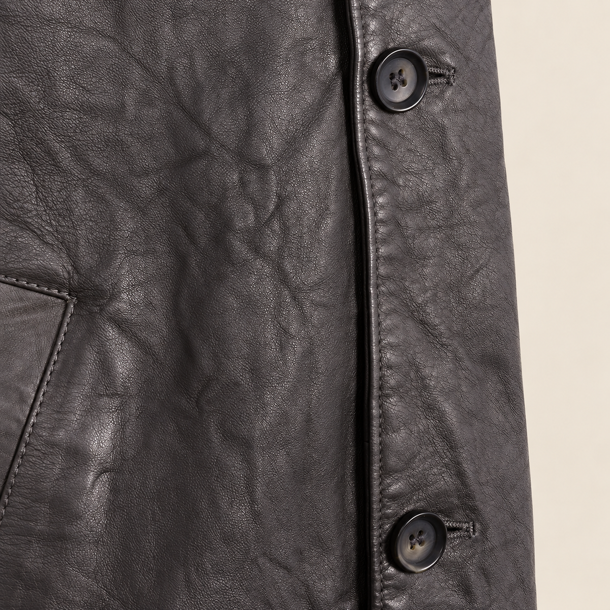 Close-up of the leather texture and construction of the Falkner men's grey retro leather coat.