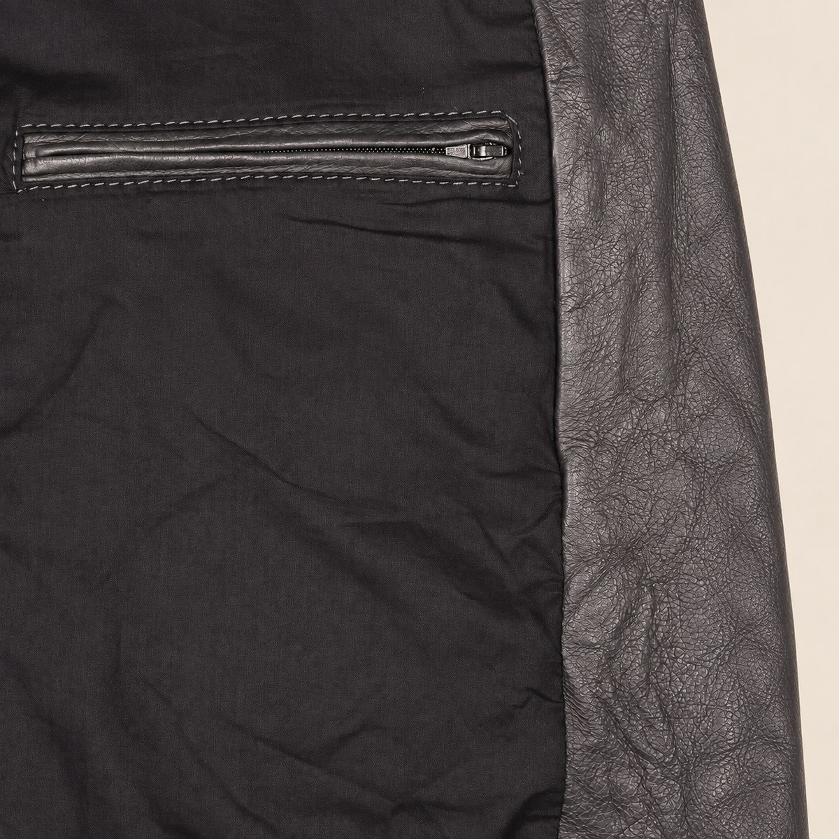 Interior construction and pocket detail of the Falkner men's grey retro leather coat.