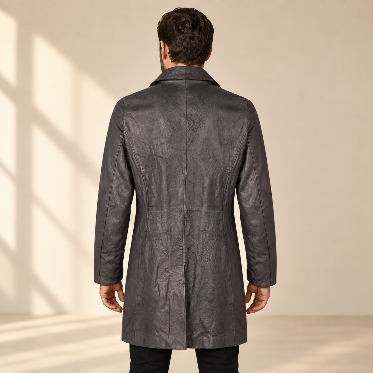 Rear view worn by a male model of the Falkner men's grey retro leather coat.