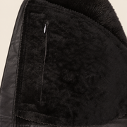 Interior construction and pocket detail of the Glenwick men's black shearling bomber jacket.