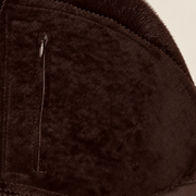 Interior construction and pocket detail of the Glenwick men's brown shearling bomber jacket.