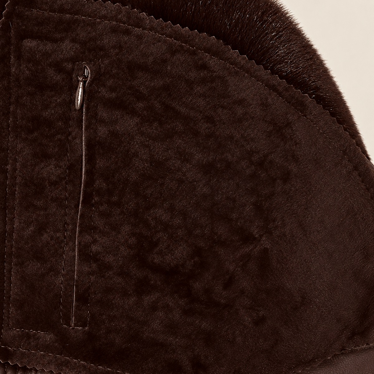 Interior construction and pocket detail of the Glenwick men's brown shearling bomber jacket.