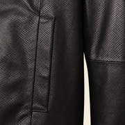 Close-up of the black perforated lambskin and vertical welt pocket stitching.
