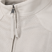 Close-up of the ivory stand collar, silver zipper and long leather zip pull.