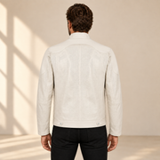 Rear model view of the Halden ivory jacket showing the curved yoke, center seam and hem tabs.