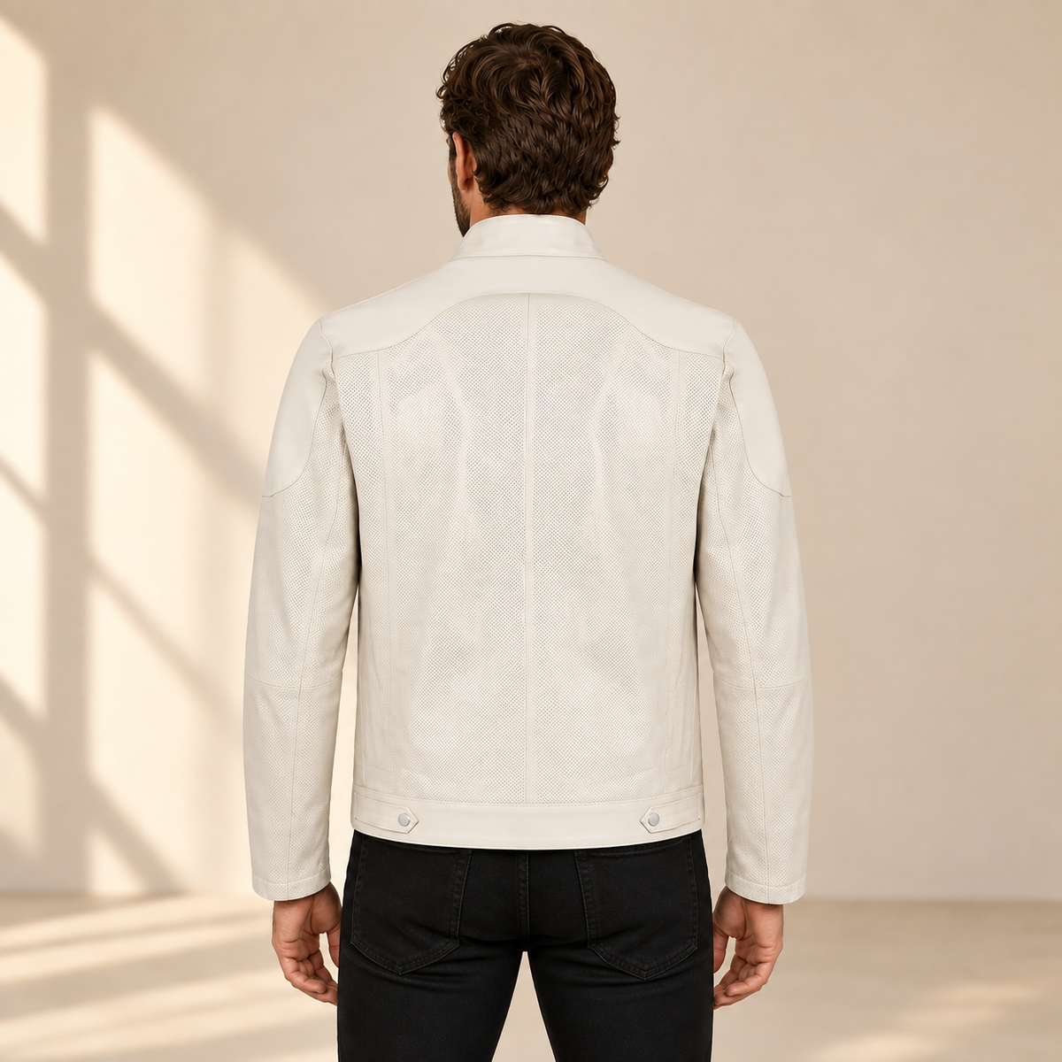 Rear model view of the Halden ivory jacket showing the curved yoke, center seam and hem tabs.