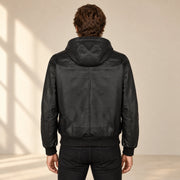 Halston Men's Hooded Lambskin Leather Bomber Jacket in black back view on male model