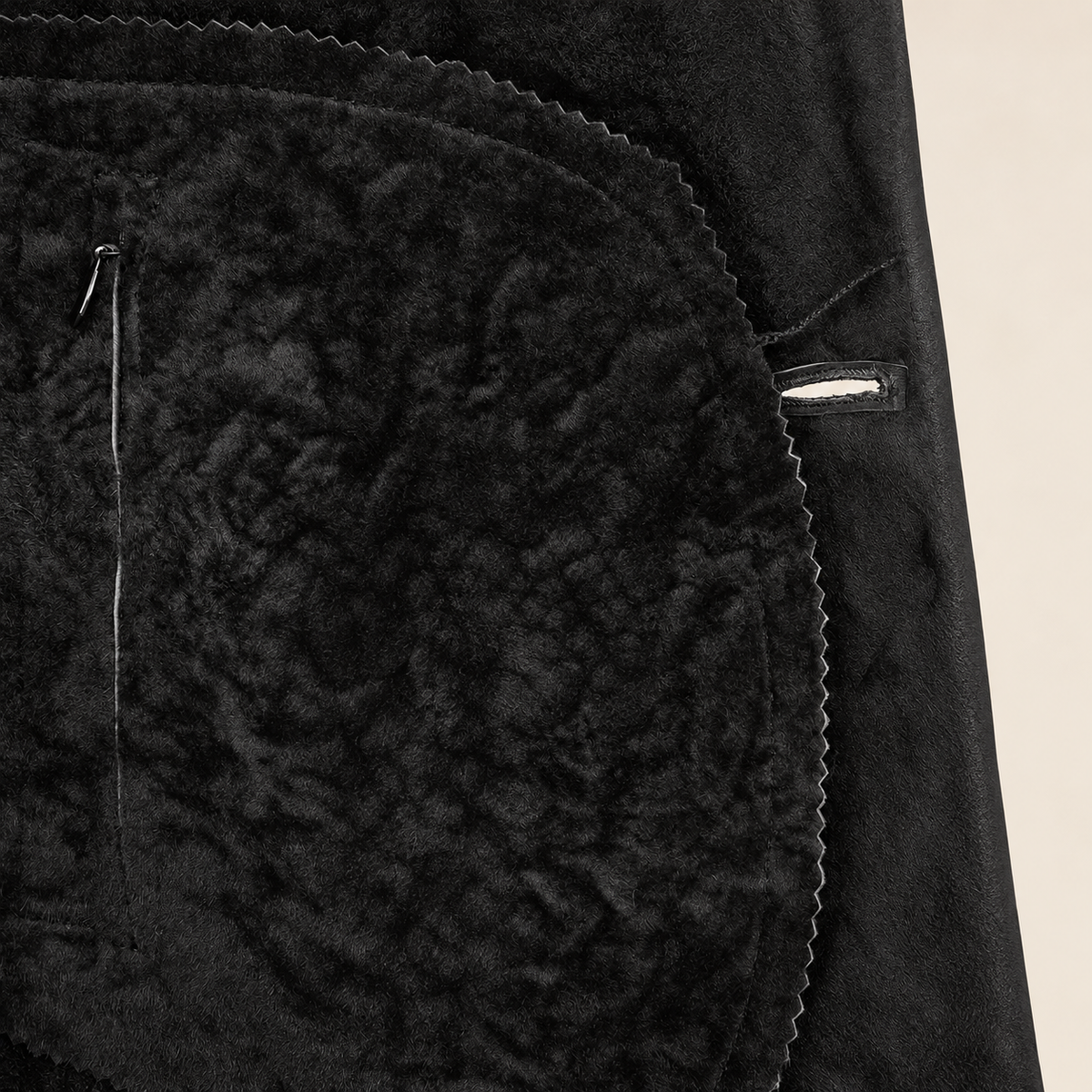 Interior construction and pocket detail of the Hawkridge men's black shearling car coat.