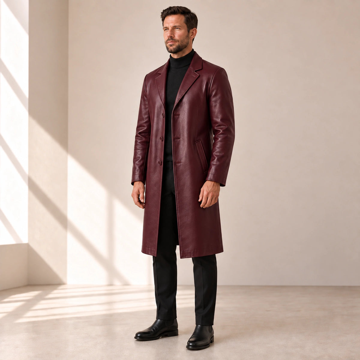 Idris men's burgundy long leather coat, right three-quarter view on model