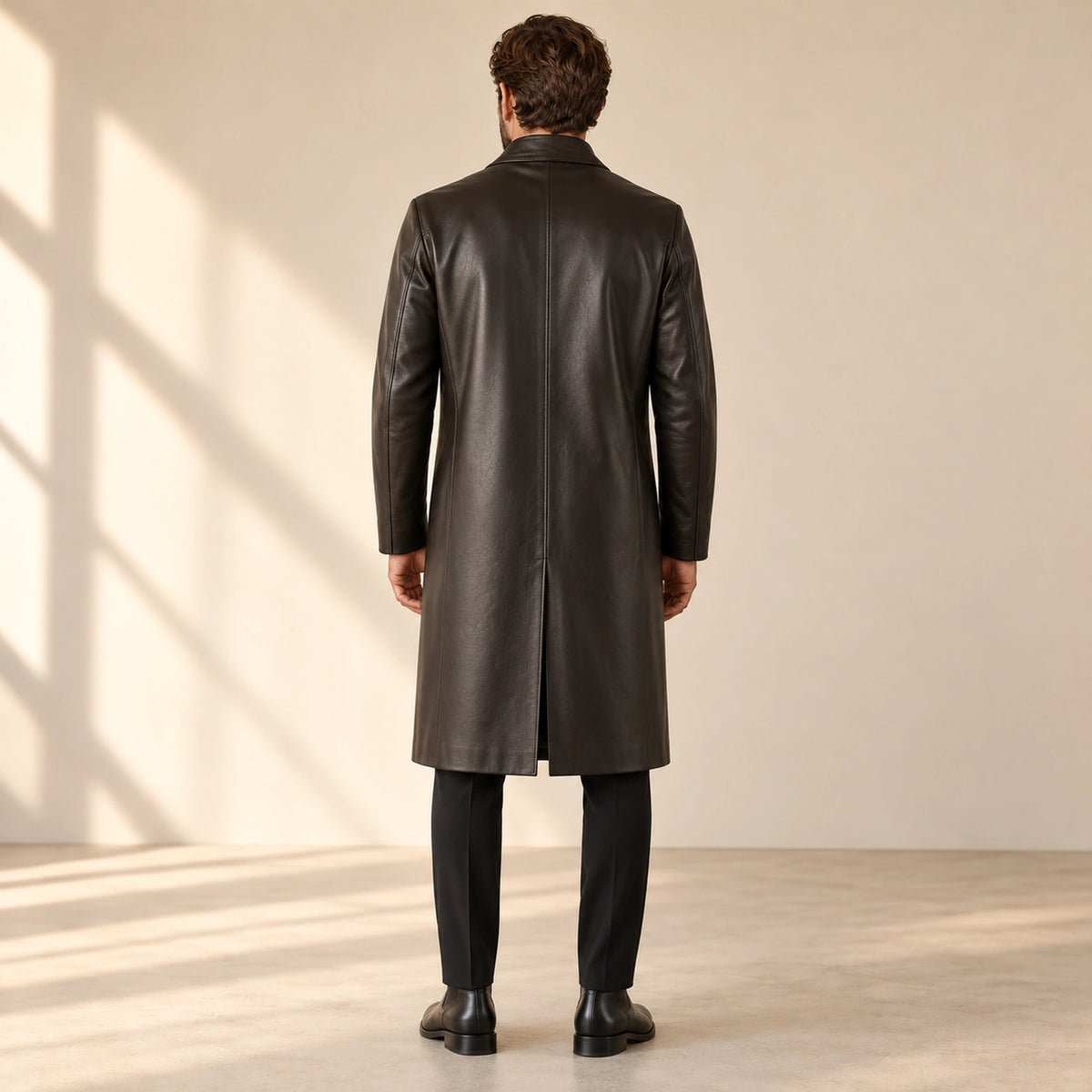 Idris men's chocolate brown long leather coat, back view on model