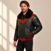 Three-quarter model view of the MOTOGRIP black, red and green lambskin leather puffer jacket, showing its black body with red and green V panels.
