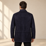 Rear view worn by a male model of the Kelston men's blue reversible suede coat.