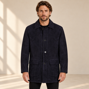Front view worn by a male model of the Kelston men's blue reversible suede coat.