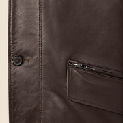 Close-up of the leather texture and construction of the Loxley men's brown leather trench coat.