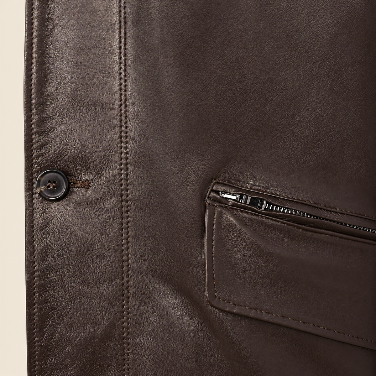 Close-up of the leather texture and construction of the Loxley men's brown leather trench coat.