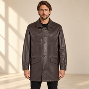 Front view worn by a male model of the Loxley men's brown leather trench coat.