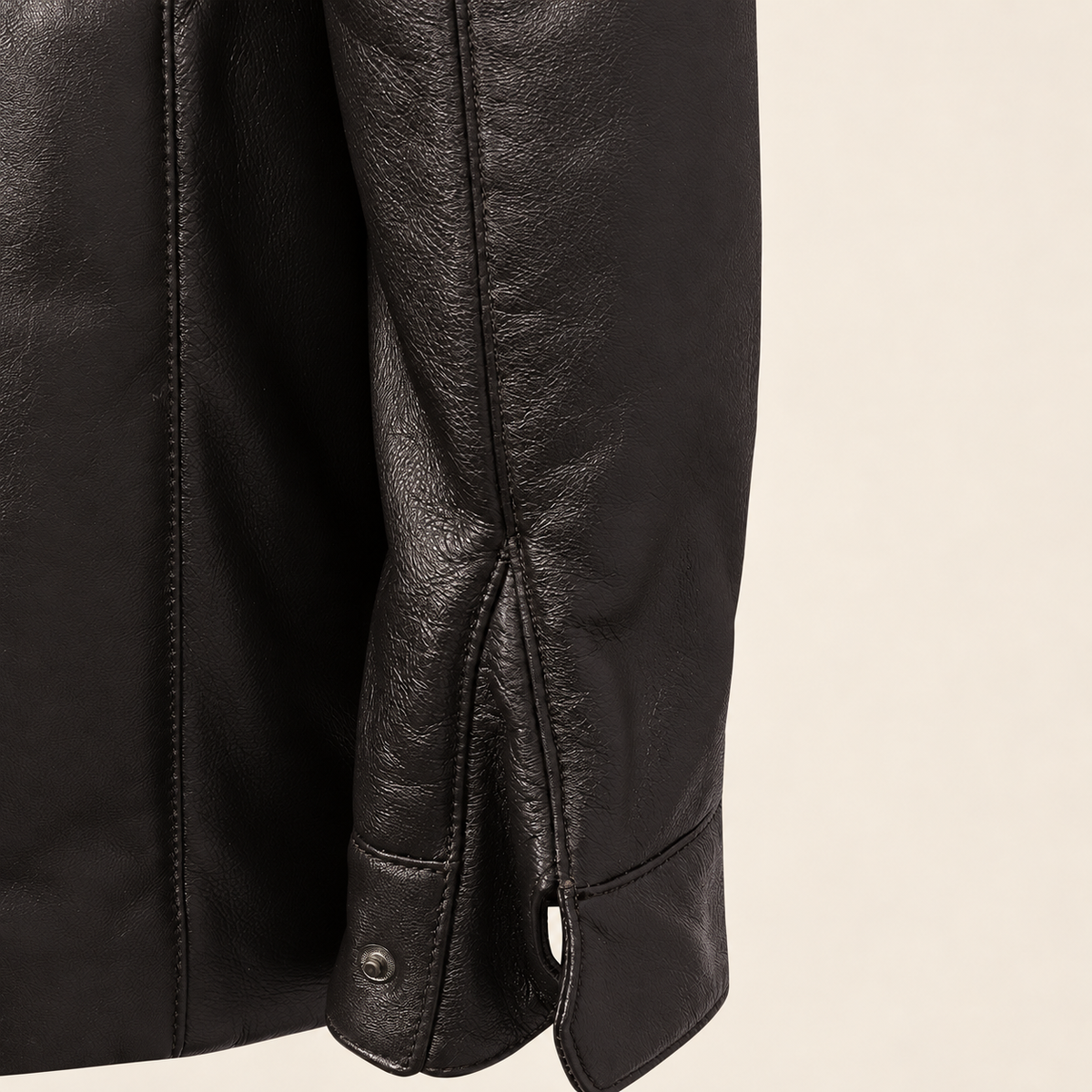 Close-up of the leather texture and construction of the Merriton men's brown leather coat.