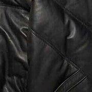 Close-up of leather texture of the MOTOGRIP black lambskin leather puffer jacket, showing its black body with tonal V stitching.