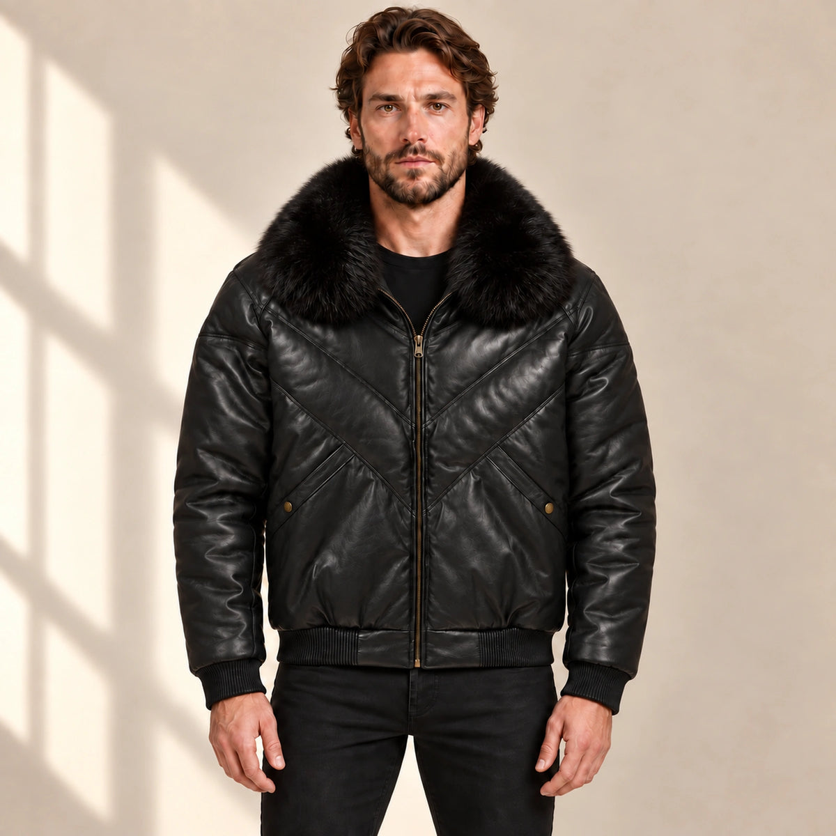 Front model view of the MOTOGRIP black lambskin leather puffer jacket, showing its black body with tonal V stitching.